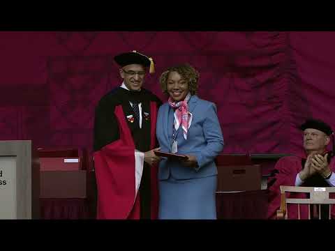 Dean Srikant Datar presents the 2023 Alumni Achievement Awards during Commencement ceremonies.
